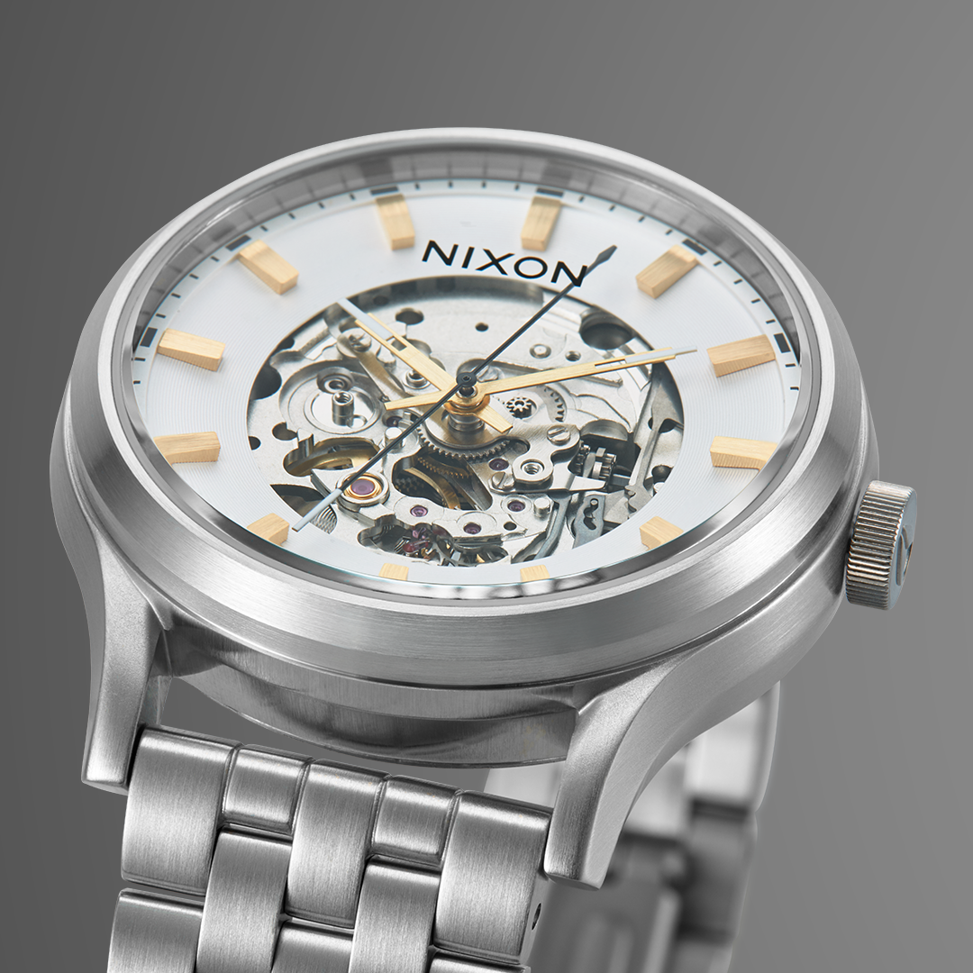 Mineral watch crystal and skeleton dial of the Nixon Spectra automatic watch