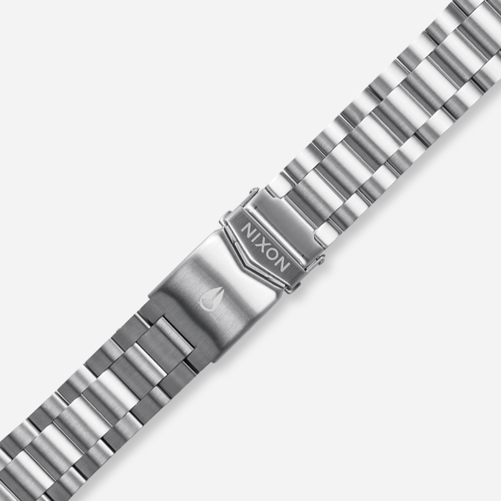 Stainless steel watch band with Nixon logo on the clasp.
